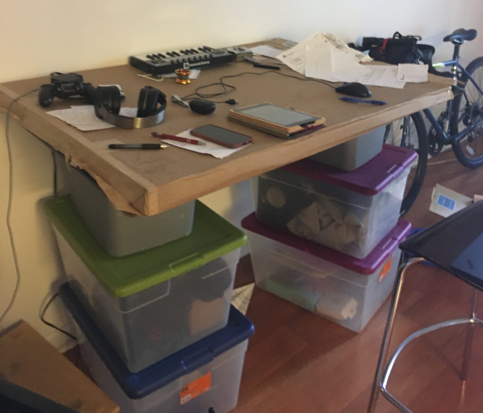 Eric's cardboard desk. He worked here for four months and kept track of his burpees directly on his desk.
